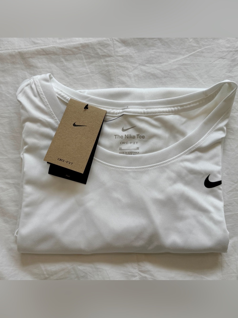 Nike Women's Short Sleeve Dri-FIT Tee in White with Black Swoosh